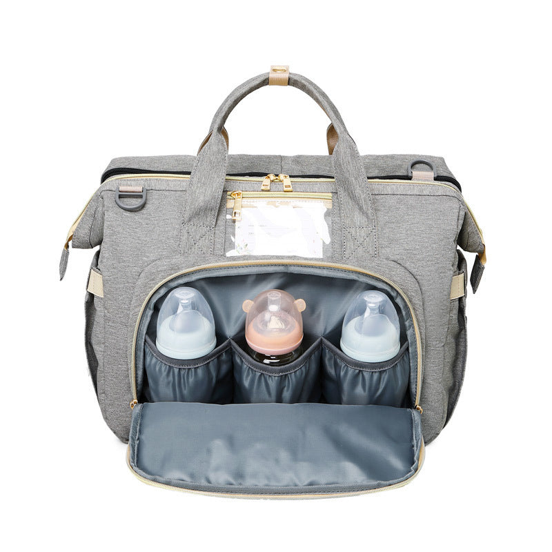 Multifunction diaper bag – with fold-out crib and storage compartments
