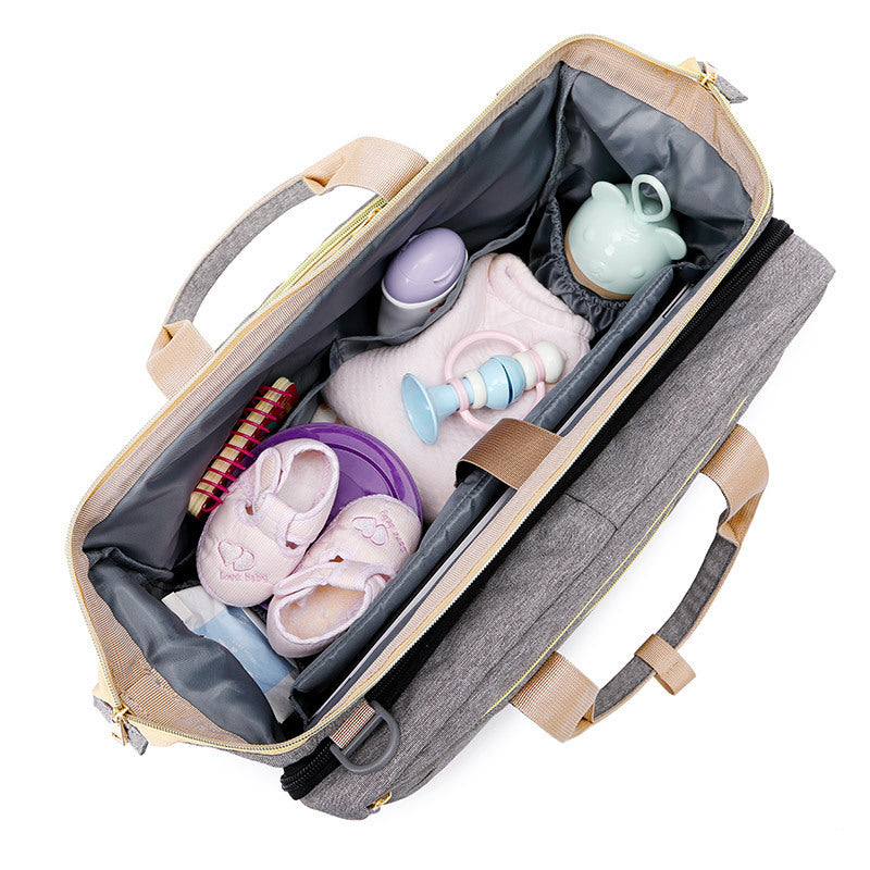 Multifunction diaper bag – with fold-out crib and storage compartments